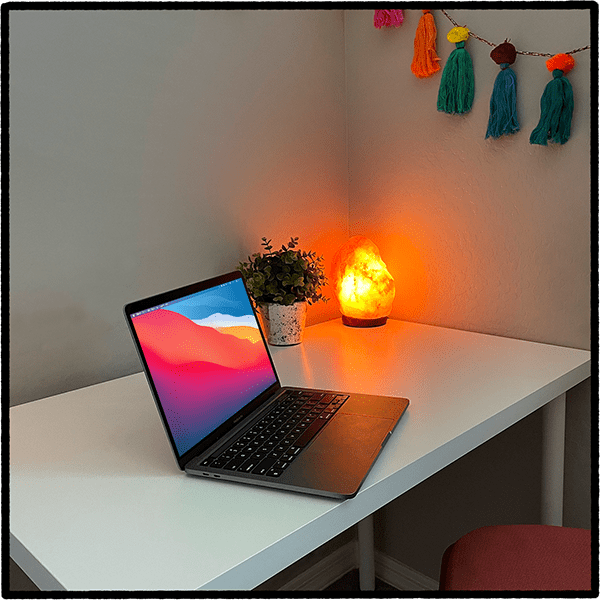 A laptop sitting at a desk